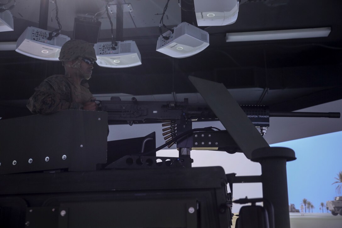 Lance Cpl. Samuel T. Mahaffey, a motor vehicle operator with 8th Engineer Support Battalion, readies a practice M2 .50-caliber machine gun during a convoy operations training simulation at Camp Lejeune, N.C., Feb. 9, 2016. Throughout the simulation, vehicle gunners practiced using the M2 .50-caliber machine gun and Mk-19 automatic grenade launcher. (U.S. Marine Corps photo by Cpl. Paul S. Martinez/Released)