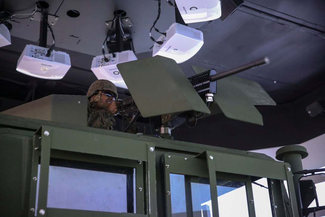 Lance Cpl. Samuel T. Mahaffey, a motor vehicle operator with 8th Engineer Support Battalion, fires a practice M2 .50-caliber machine gun during a convoy operations training simulation at Camp Lejeune, N.C., Feb. 9, 2016. Throughout the simulation, vehicle gunners practiced using the M2 .50-caliber machine gun and Mk-19 automatic grenade launcher. (U.S. Marine Corps photo by Cpl. Paul S. Martinez/Released)