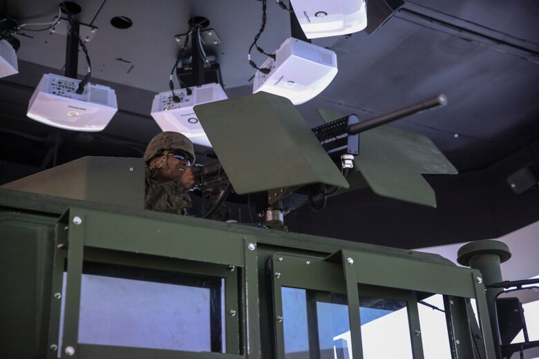 Lance Cpl. Samuel T. Mahaffey, a motor vehicle operator with 8th Engineer Support Battalion, fires a practice M2 .50-caliber machine gun during a convoy operations training simulation at Camp Lejeune, N.C., Feb. 9, 2016. Throughout the simulation, vehicle gunners practiced using the M2 .50-caliber machine gun and Mk-19 automatic grenade launcher. (U.S. Marine Corps photo by Cpl. Paul S. Martinez/Released)