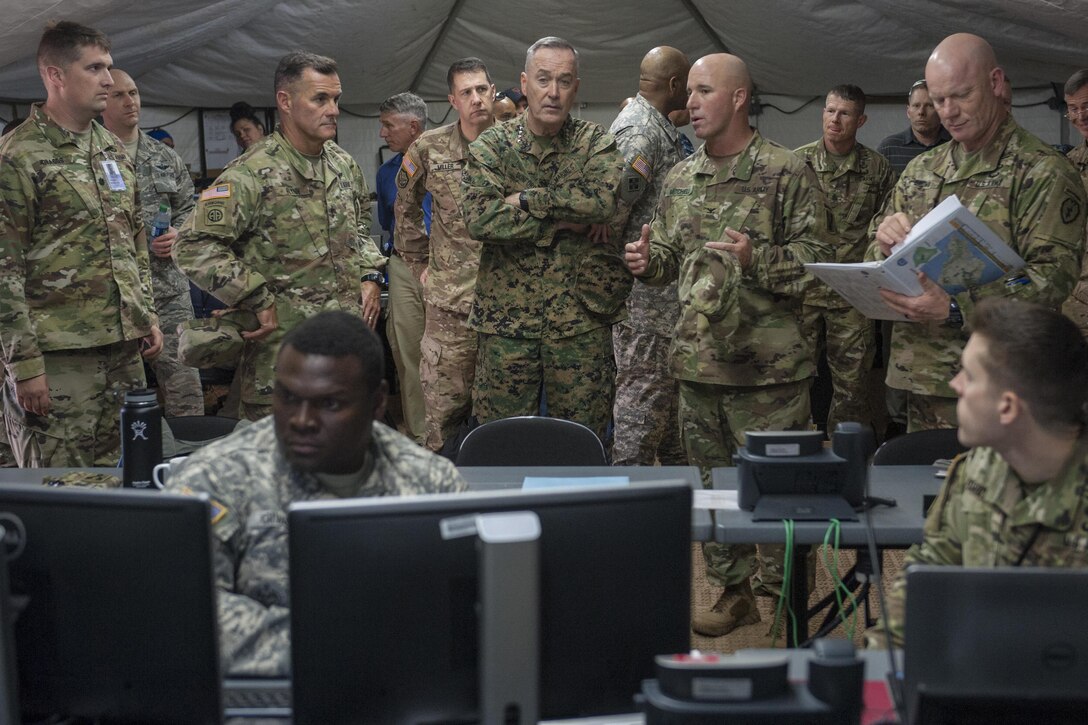 Marine Corps Gen. Joseph F. Dunford Jr., chairman of the Joint Chiefs of Staff, tours an exercise site on Schofield Barracks, Hawaii, Feb. 9, 2016. DoD Photo by Navy Petty Officer 2nd Class Dominique A. Pineiro