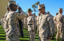 Captain Gilbert C. Garlit, series commander, and a senior drill instructor of India Company, 3rd Recruit Training Battalion, watches a recruit perform the drill movement, inspection arms, during a series commander inspection at Marine Corps Recruit Depot San Diego, Feb. 8. After performing inspection arms, recruits introduced themselves with a report that included name, military occupational specialty and hometown. Annually, more than 17,000 males recruited from the Western Recruiting Region are trained at MCRD San Diego. India Company is scheduled to graduate March 11. 