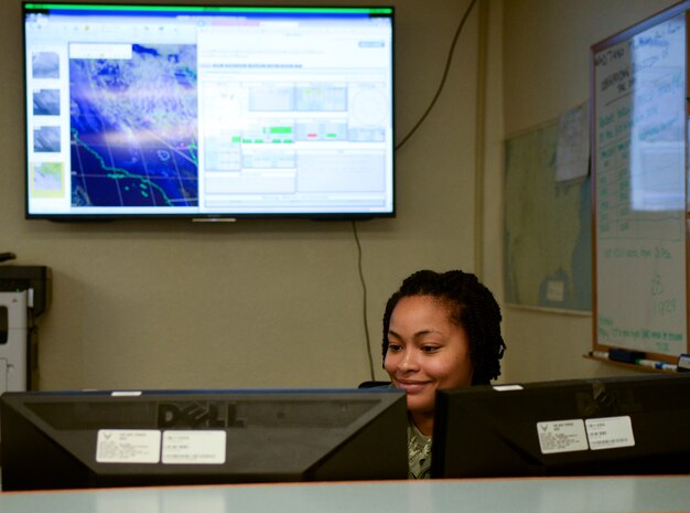Senior Airman Angela Atkins, 57th Operations Support Weather Flight weather forecaster, looks over the weather conditions at Nellis Air Force Base, Nev., Feb. 3, 2016. The 57th Operations Support Weather Flight is tasked with calculating and monitoring weather to provide key information that directly affects daily flying operations. (U.S. Air Force photo by Airman 1st Class Nathan Byrnes)