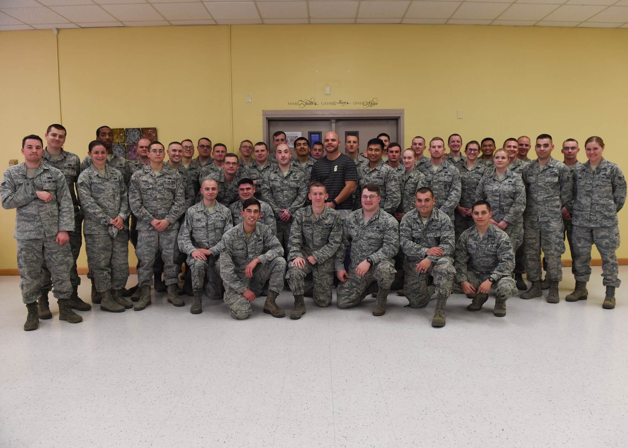 Chad Johnson, the Pittsburgh Steelers chaplain, poses with the Airmen Leadership School class at the base chapel Holloman Air Force Base, N.M. Feb. 9. Johnson visited the chapel to show his support by having lunch with the ALS class and spoke about his experience being an NFL chaplain. (U.S. photo by Senior Airman Leah Ferrante) 