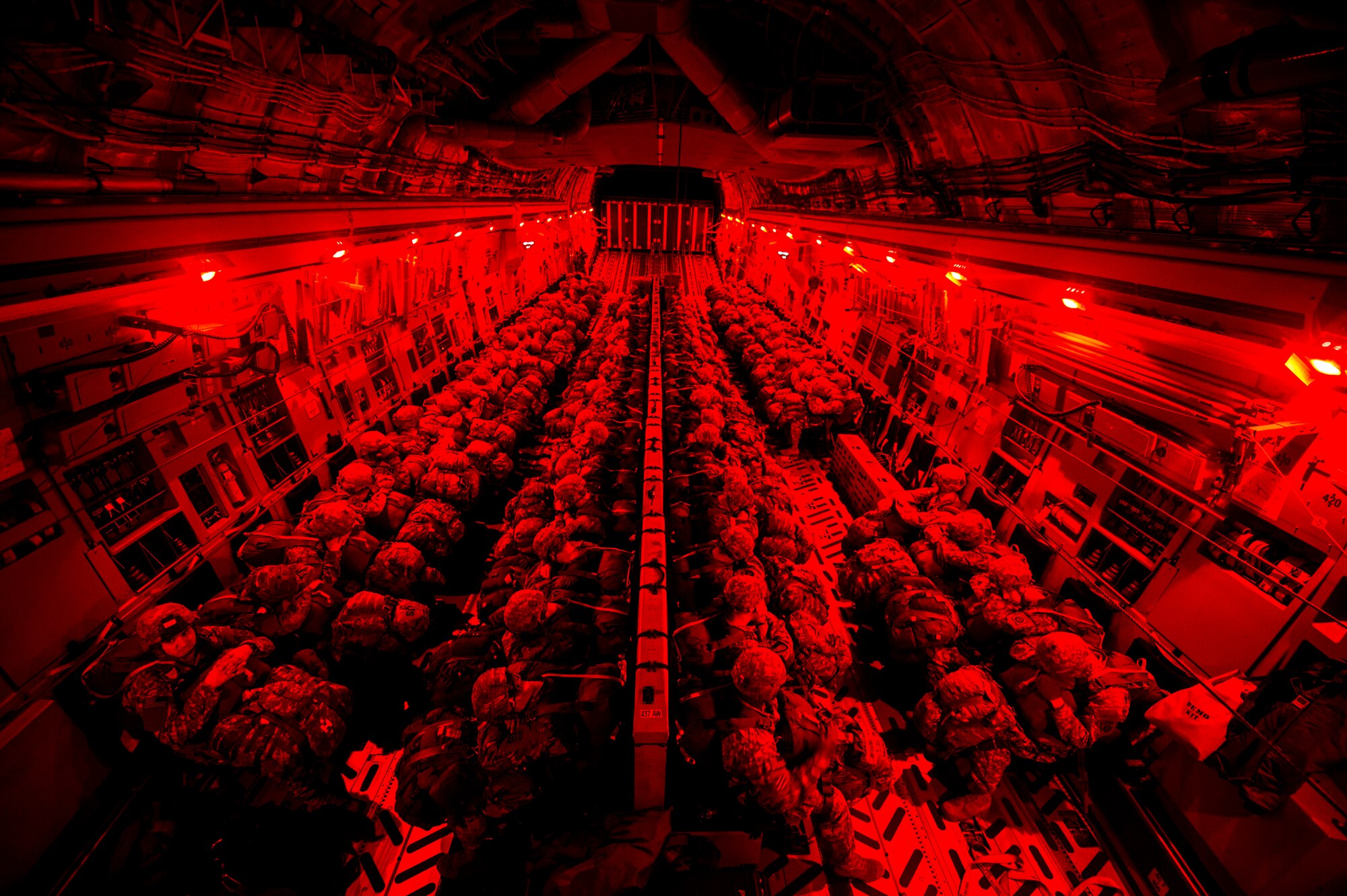 U.S. Army Soldiers from the 3rd Battalion, 319th Airborne Field Artillery Regiment, 82nd Airborne Division, wait on board a U.S. Air Force C-17 cargo aircraft from Joint Base Charleston, S.C., to conduct a personnel drop in support of airdrop operations during Large Package Week on Fort Bragg, N.C., Feb. 7, 2016. Large Package Week is a lead up to Joint Operational Access Exercise 16-5 that prepares Army and Air Force units for worldwide crisis and contingency operations. (U.S. Air Force Photo by Staff Sgt. Gregory Brook)