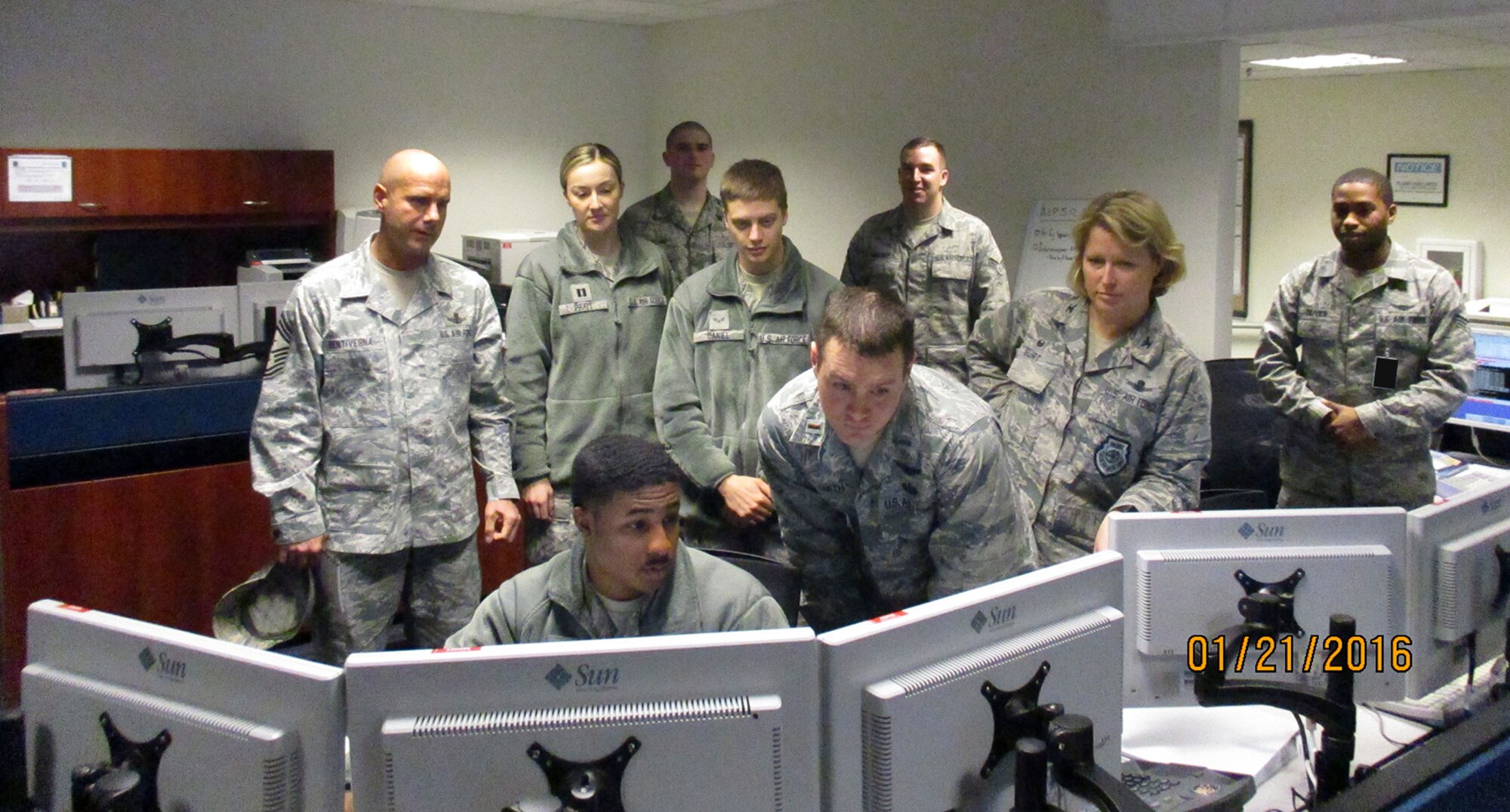 Airmen with 2nd and 19th Space Operations Squadron conduct a mission operations transfer as Col. DeAnna M. Burt, 50th Space Wing commander, and Chief Master Sgt. John Bentivegna, 50 SW command chief, observe Jan. 21, 2016, at the alternate location. Although the two squadrons have always worked side by side in accomplishing the GPS mission at the Master Control Station on Schriever Air Force Base, Colorado, this is the first time the active duty and Reserve units conducted the transfer mission as an equal 50/50 mix of personnel. (Courtesy photo)