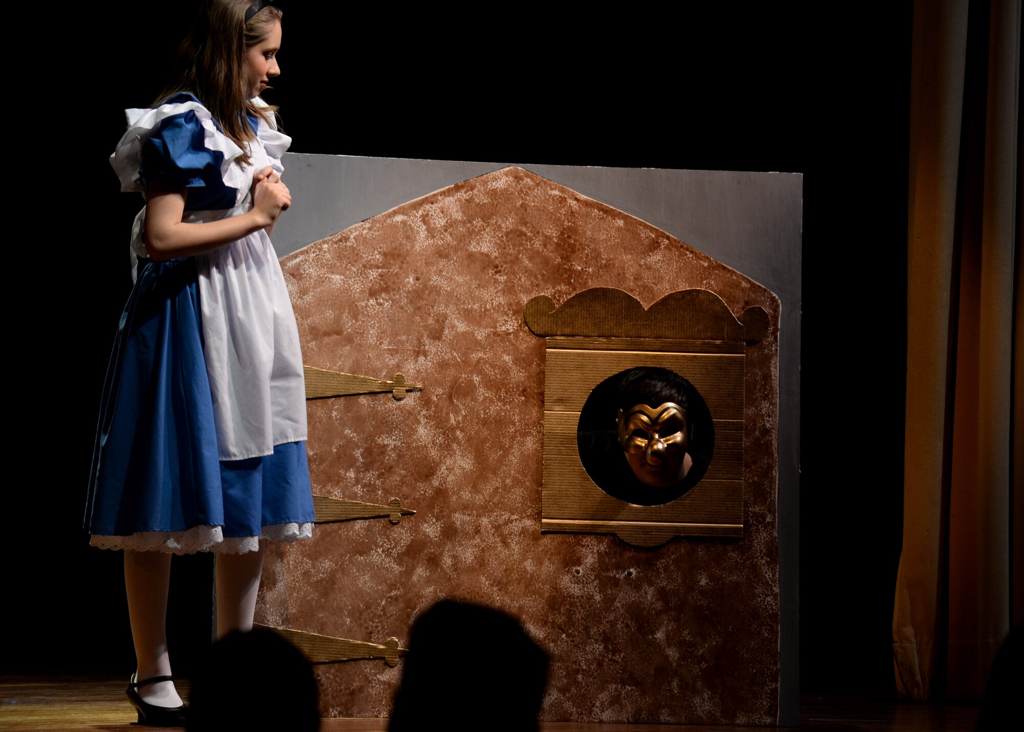 Samantha Dickey performs as Alice in a scene from “Alice in Wonderland Jr.,” Feb 4, 2016, at Aviano Air Base, Italy. The cast performed the play for four nights, which followed Alice’s journey down the rabbit hole. (U.S. Air Force photo by Airman 1st Class Cary Smith/Released)
