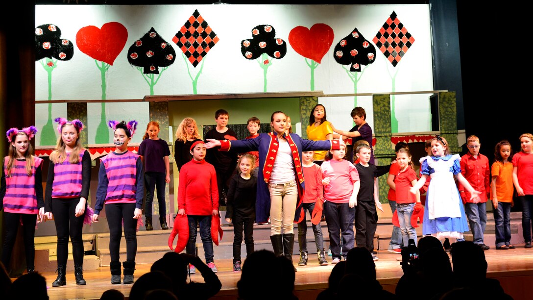 Performers sing and dance during “Alice in Wonderland Jr.,” Feb 4, 2016, at Aviano Air Base, Italy. High school students, Sara Barton and Maggie Lewandowski, directed the play performed by 3rd- to 12th-grade students for all of Team Aviano. (U.S. Air Force photo by Airman 1st Class Cary Smith/Released)
