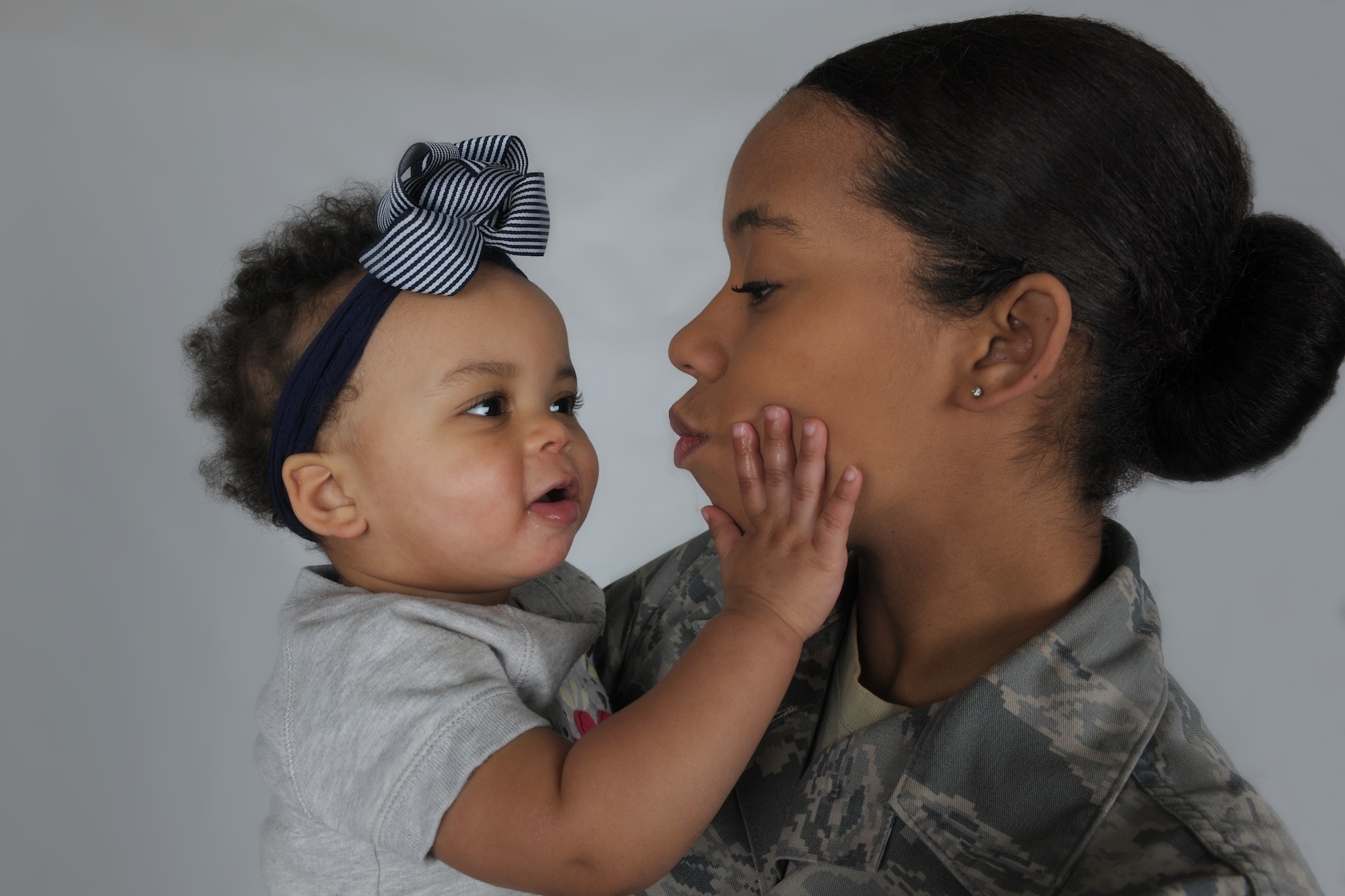 Senior Airman Maryiah Blake, 100th Logistics Readiness Squadron equipment liaison journeyman, poses with her daughter, Gabby, at Royal Air Force Lakenheath, England, Jan. 22, 2016. Blake is a single mom raising her daughter with an unfailingly positive outlook. (U.S. Air Force Photo/Airman 1st Class Erin R. Babis)