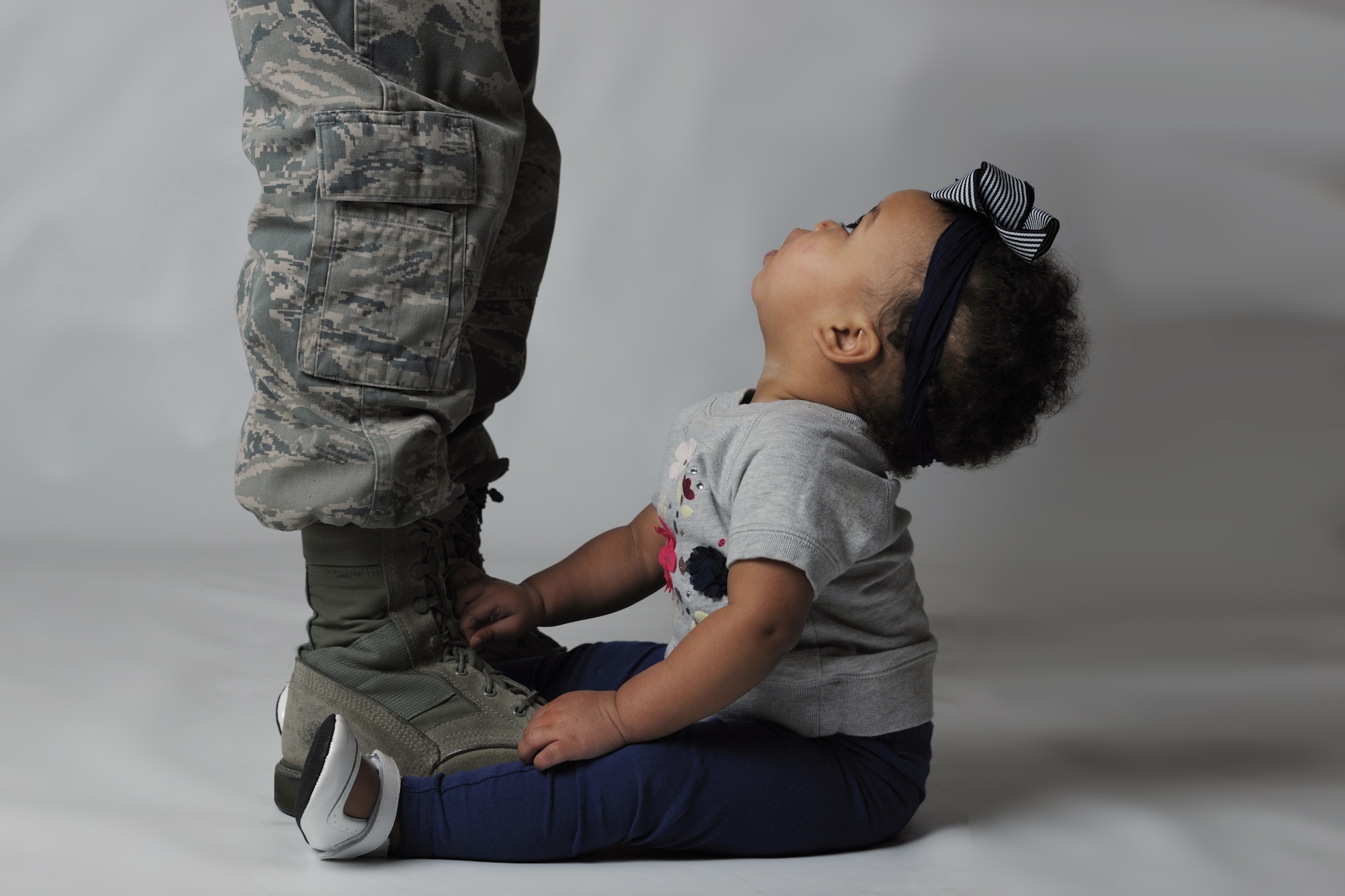 Senior Airman Maryiah Blake, 100th Logistics Readiness Squadron equipment liaison journeyman, poses with her daughter, Gabby, at Royal Air Force Lakenheath, England, Jan. 22, 2016. Initially, Blake had been advised her daughter would be born with Down syndrome while she was on emergency leave before her mother passed away. When Gabby was born, Blake was thankful to find she had a perfectly healthy little girl, but she said she would have been happy either way.  (U.S. Air Force Photo/Airman 1st Class Erin R. Babis)