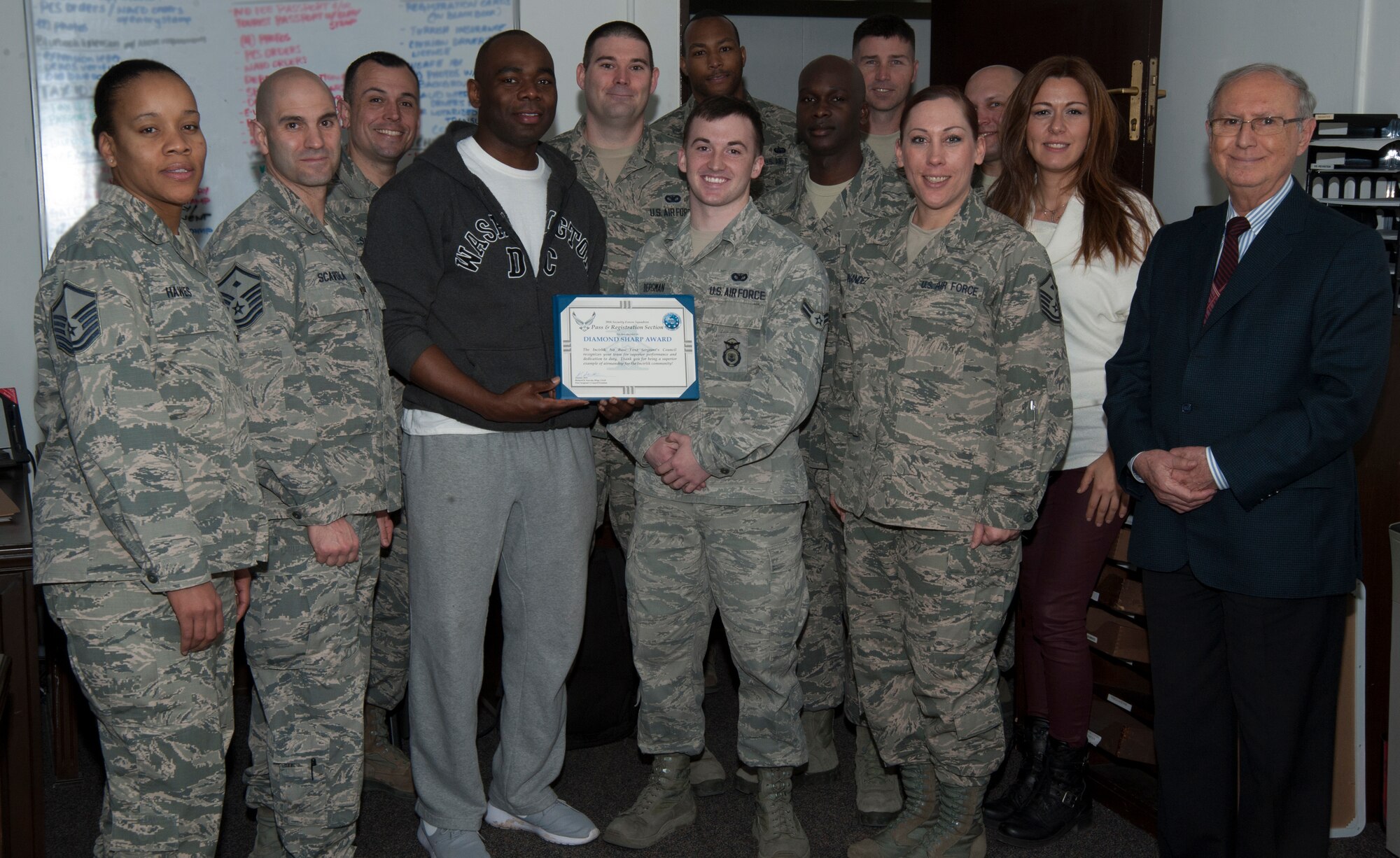Members of the 39th Security Forces Squadron Pass and Registration pose with first sergeants after receiving the Diamond Sharp award Feb. 9, 2016, on Incirlik Air Base, Turkey. The first sergeant council recognizes individuals and teams for their superior performance and dedication to the mission. (U.S. Air Force photo by Airman 1st Class Daniel Lile/Released)