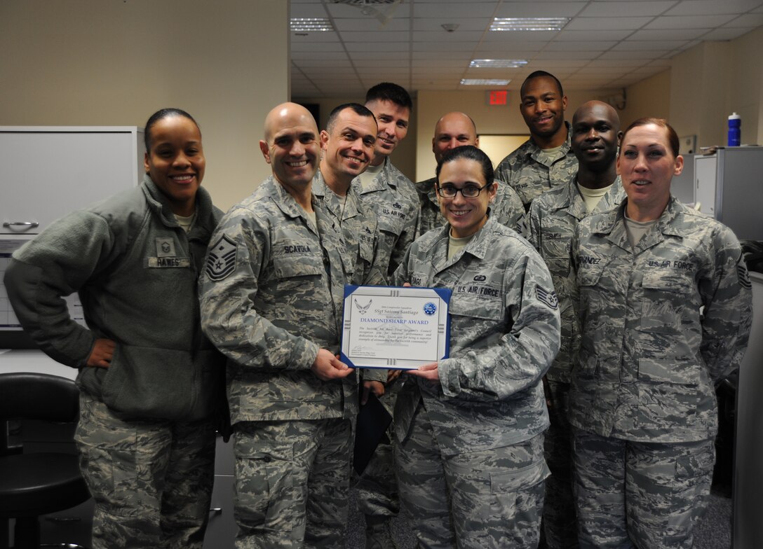 U.S. Air Force Staff Sgt. Saiomy Santiago, 39th Comptroller Squadron budget analyst, poses with first sergeants after being awarded the Diamond Sharp award Feb. 9, 2016, on Incirlik Air Base, Turkey. Santiago earned the award by distinguishing herself through outstanding professionalism, performance and display of the Air Force core values. (U.S. Air Force photo by Airman 1st Class Daniel Lile/Released)