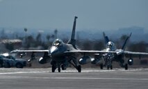 An F-16CJ from McEntire Joint National Guard Base, S.C. taxies on the flightline during Red Flag 16-1, Jan. 28, 2016 at Nellis AFB, Nev. Red Flag 16-1’s training is centered on readiness through completing combat-realistic missions in a degraded, operationally limited environment. (U.S. Air Force photo by Senior Airman Alex Fox Echols III/Released)  
