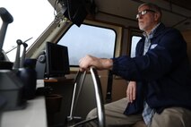 Ray Gallien, 82nd Aerial Targets Squadron Florida off-shore incorporated manager, sits behind a 120-foot drone recovery vessel’s helm Feb. 4 at the Bonita Bay 82nd ATRS water recovery operations facility. It is this facility’s responsibility to recover downed BQM-167 subscale drones used in simulated air-to-air combat. (U.S. Air Force photo by Senior Airman Ty-Rico Lea)