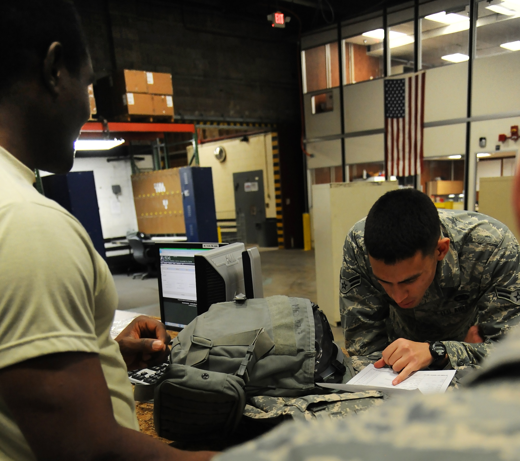 U.S. Air Force Airman 1st Class Kenneth Fleischer, a 509th Munitions Squadron weapons maintenance team member, checks his issued items at Whiteman Air Force Base, Mo., Feb. 3, 2016. The 509th Logistics Readiness Squadron individual protective equipment (IPE) section issues equipment to members of the 509th Bomb Wing (BW), 131st BW and 442d Fighter Wing for deployments and training.  (U.S. Air Force photo by Airman 1st Class Michaela R. Slanchik)