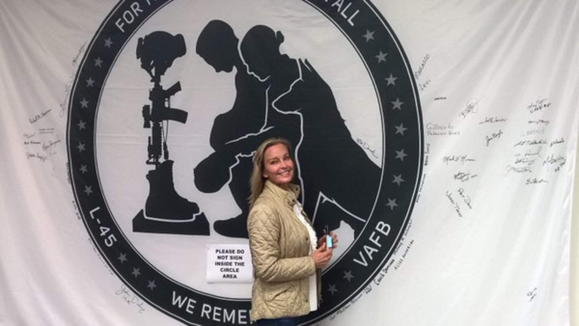 Actress Bo Derek, a self-proclaimed local Vandenberg AFB girl, signs a banner for the NROL-45 satellite during a recent visit to the base. The mission's emblem on the payload fairing featured the silhouette of a military working dog sitting beside two soldiers kneeling at a memorial to a fallen comrade and the line, For those who have given all, we remember. A United Launch Alliance Delta IV Medium+ (5,2) rocket successfully delivered a satellite, designated NROL-45, to orbit for the National Reconnaissance Office after lifting off at 3:40 a.m. PST Feb. 10, 2016 from Space Launch Complex-6 at Vandenberg Air Force Base, located on California's Central Coast. (Courtesy photo)