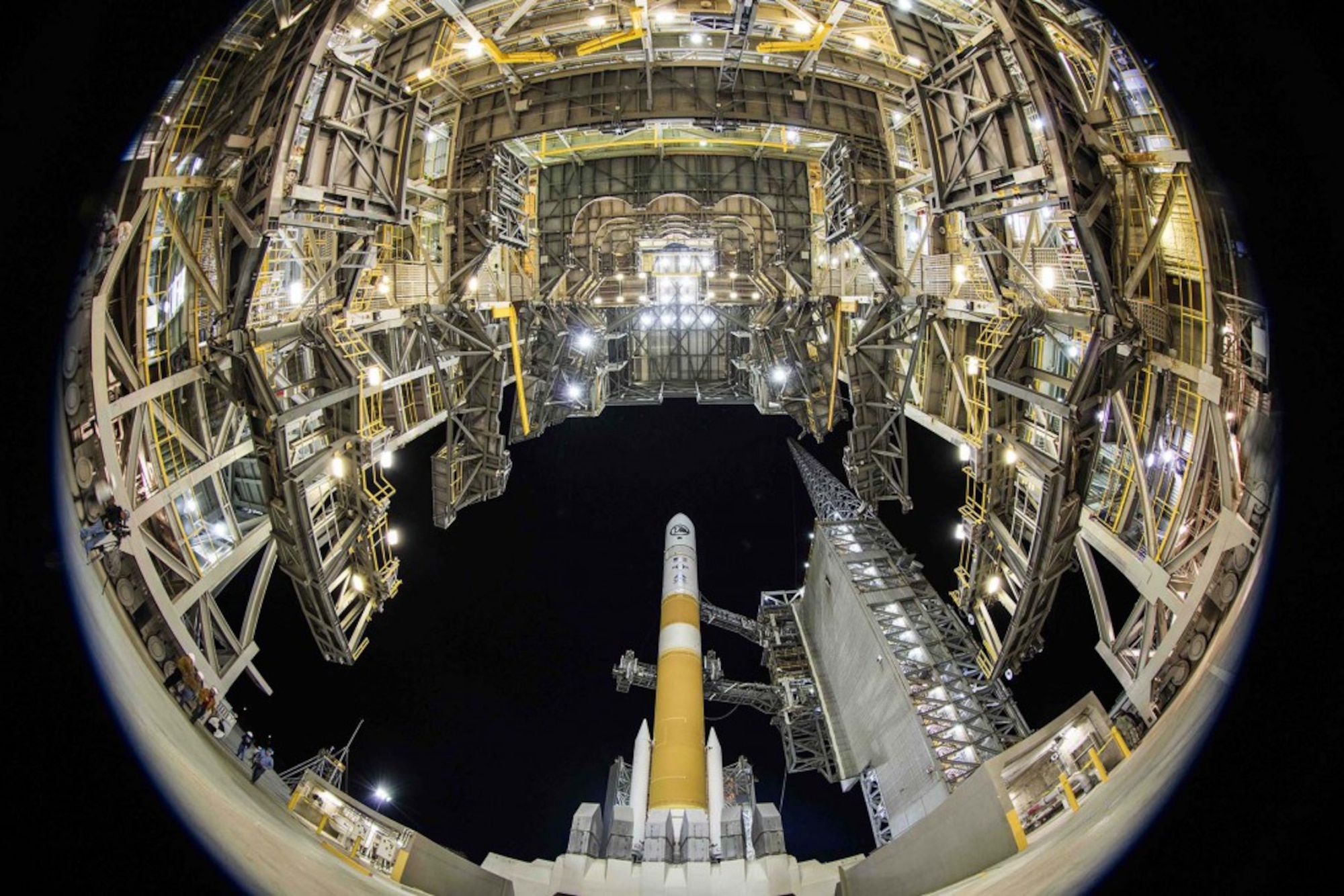 A fisheye lens captures a dramatic view of the United Launch Alliance's Delta IV Medium+ (5,2) rocket after rollback of the Mobile Service Tower at Space Launch Complex-6, Vandenberg Air Force Base, Calif., on Feb. 10, 2016. The Evolved Expendable Launch Vehicle successfully delivered a satellite, designated NROL-45, to orbit for the National Reconnaissance Office after lifting off at 3:40 a.m. PST from SLC-6 at Vandenberg AFB, located in northern Santa Barbara County on California's Central Coast. (Courtesy photo: ULA)