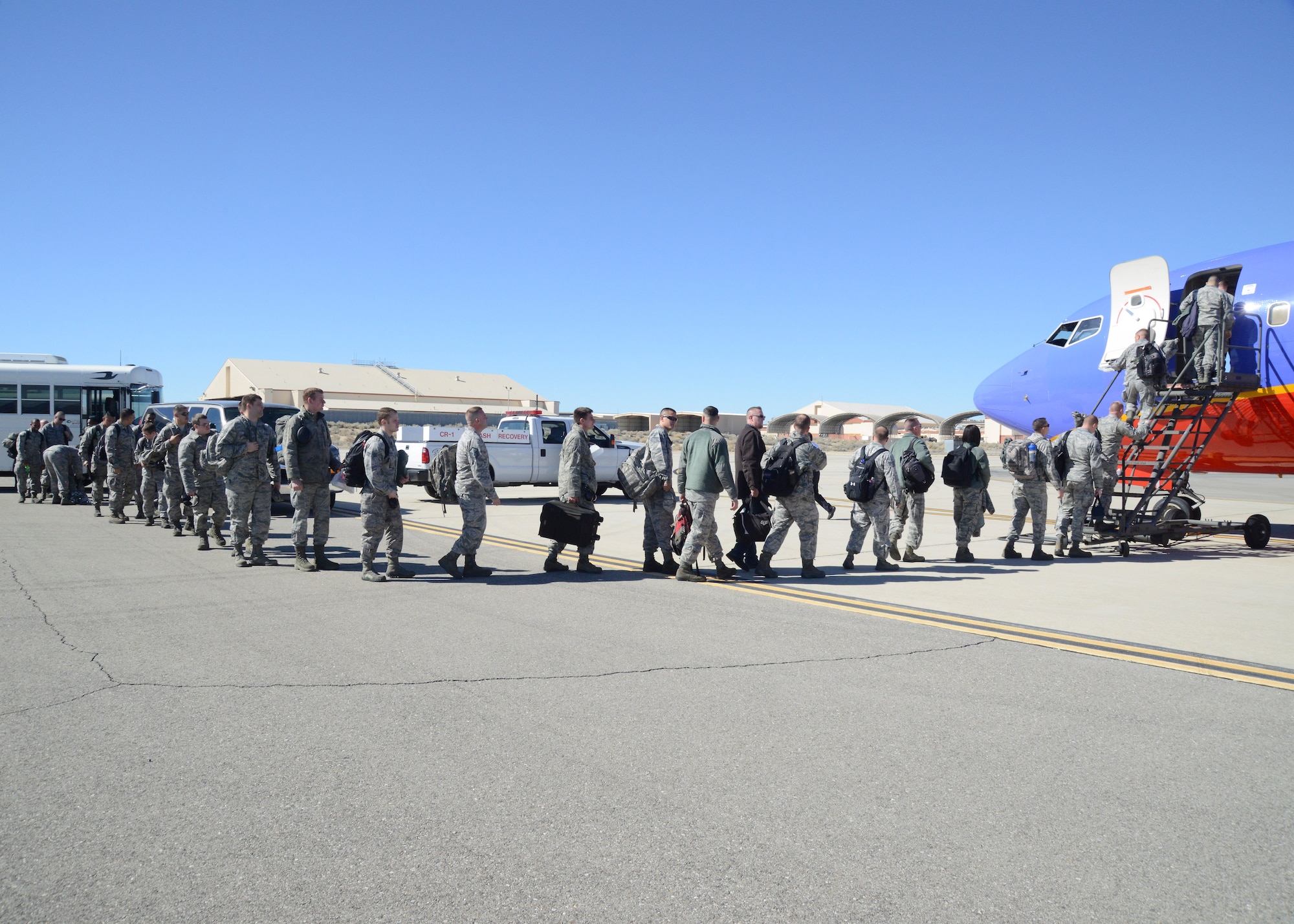 Airmen from the 31st Test and Evaluation Squadron board a Southwest 737 Feb. 9. The commercially contracted plane took the Airmen, mostly maintainers, to Mountain Home Air Force Base, Idaho. (U.S. Air Force photo by Kenji Thuloweit)