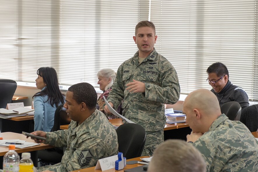 Capt. Matthew McPhail, 374th Airlift Wing Safety Office flight safety officer, briefs a positive logic safety plan during a risk management application and integration course at Yokota Air Base, Japan, Feb. 3, 2016. Airmen from bases throughout the Pacific Air Forces attended the four-day course to learn new methods to improve flightline safety. (U.S. Air Force photo by Senior Airman David C. Danford/Released)