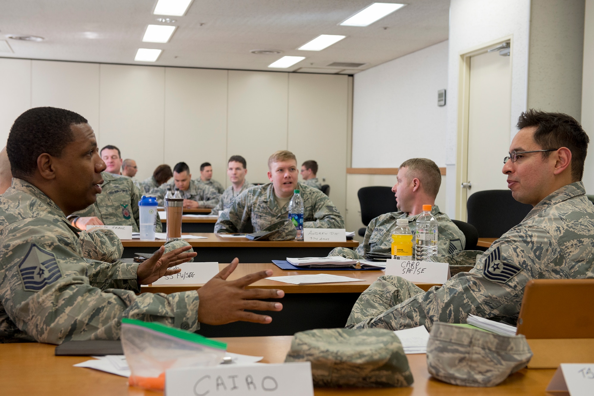 Airmen take part in small-group activities during a risk management application and integration course at Yokota Air Base, Japan, Feb. 3, 2016. Bases from across the Pacific Air Forces sent safety representatives to the four-day course where they learned how to identify and mitigate potential safety risks. (U.S. Air Force photo by Senior Airman David C. Danford/Released)