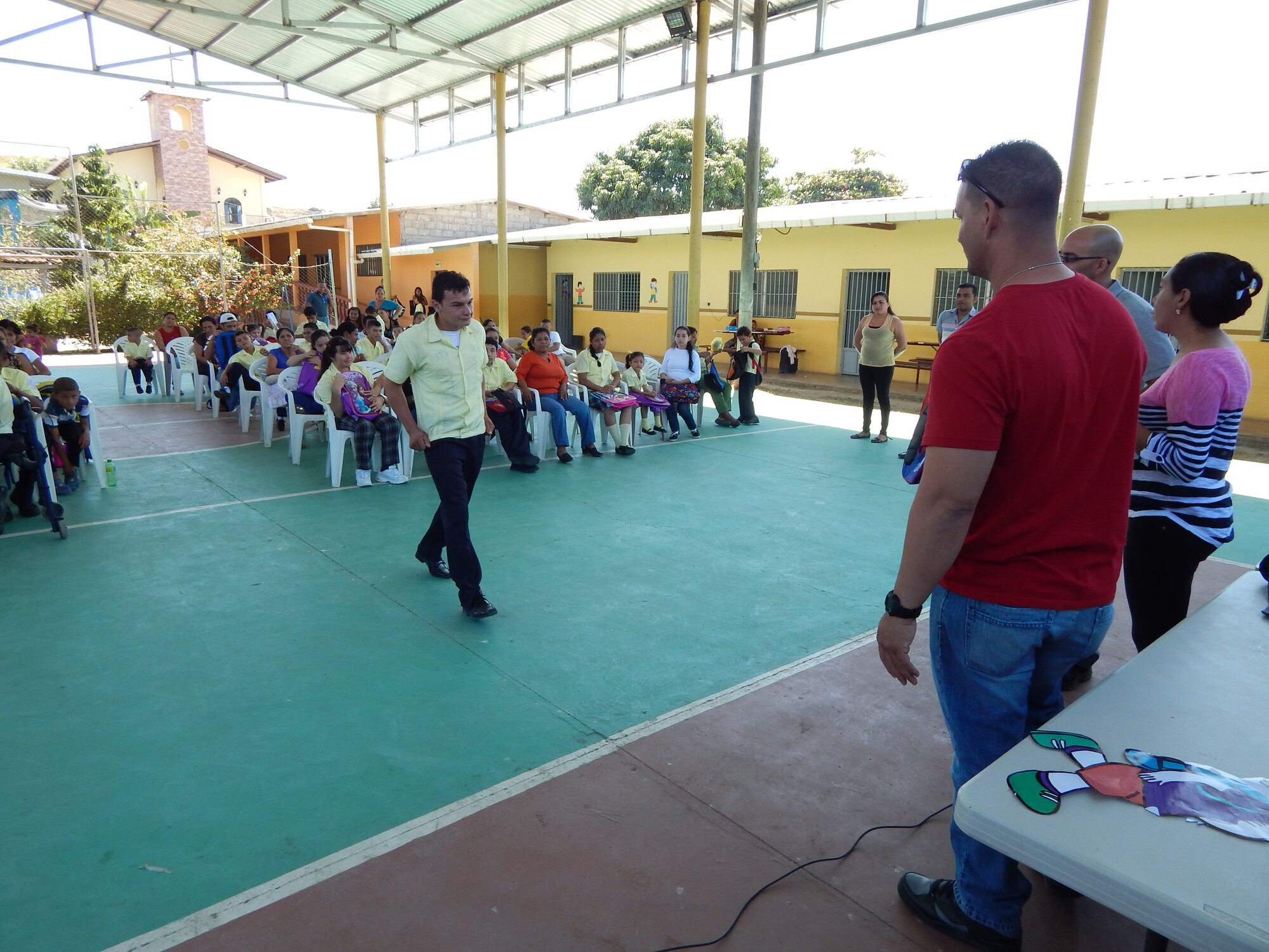Comayagua, Honduras – Tutors from the CasAyuda Foundation gather the children to receive donated school materials from Joint Task Force-Bravo Joint Security Forces volunteers, Feb 02, 2016, Comayagua, Honduras. The volunteers gathered funds within their unit to purchase backpacks, notebooks, pencils and other materials to encourage the importance of learning among the special needs children.  (U.S. Army photo by SPC. Audie Colón)