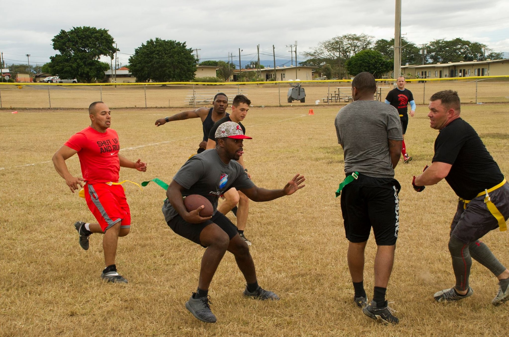 Pictured center, Keith Tandy, Tampa Bay Buccaneers safety, plays a game of flag football with Servicemembers Feb. 6, 2016 at Soto Cano Air Base, Honduras, as a part of a visit to the base hosted by the Armed Forces Entertainment organization for Super Bowl 50. (U.S. Air Force photo by Capt. Christopher Mesnard/Released)