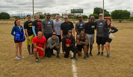 Servicemembers with the Army Force Battalion at Soto Cano Air Base, Honduras, pose for a photo with NFL players and cheerleaders after a game of flag football Feb. 6, 2016, as a part of a visit to the base hosted by the Armed Forces Entertainment for Super Bowl 50. (U.S. Air Force photo by Capt. Christopher Mesnard/Released)