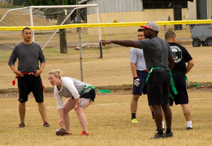 Pictured right, Keith Tandy, Tampa Bay Buccaneers safety, plays a game of flag football with Servicemembers Feb. 6, 2016 at Soto Cano Air Base, Honduras, as a part of a visit to the base hosted by the Armed Forces Entertainment organization for Super Bowl 50. (U.S. Air Force photo by Capt. Christopher Mesnard/Released)