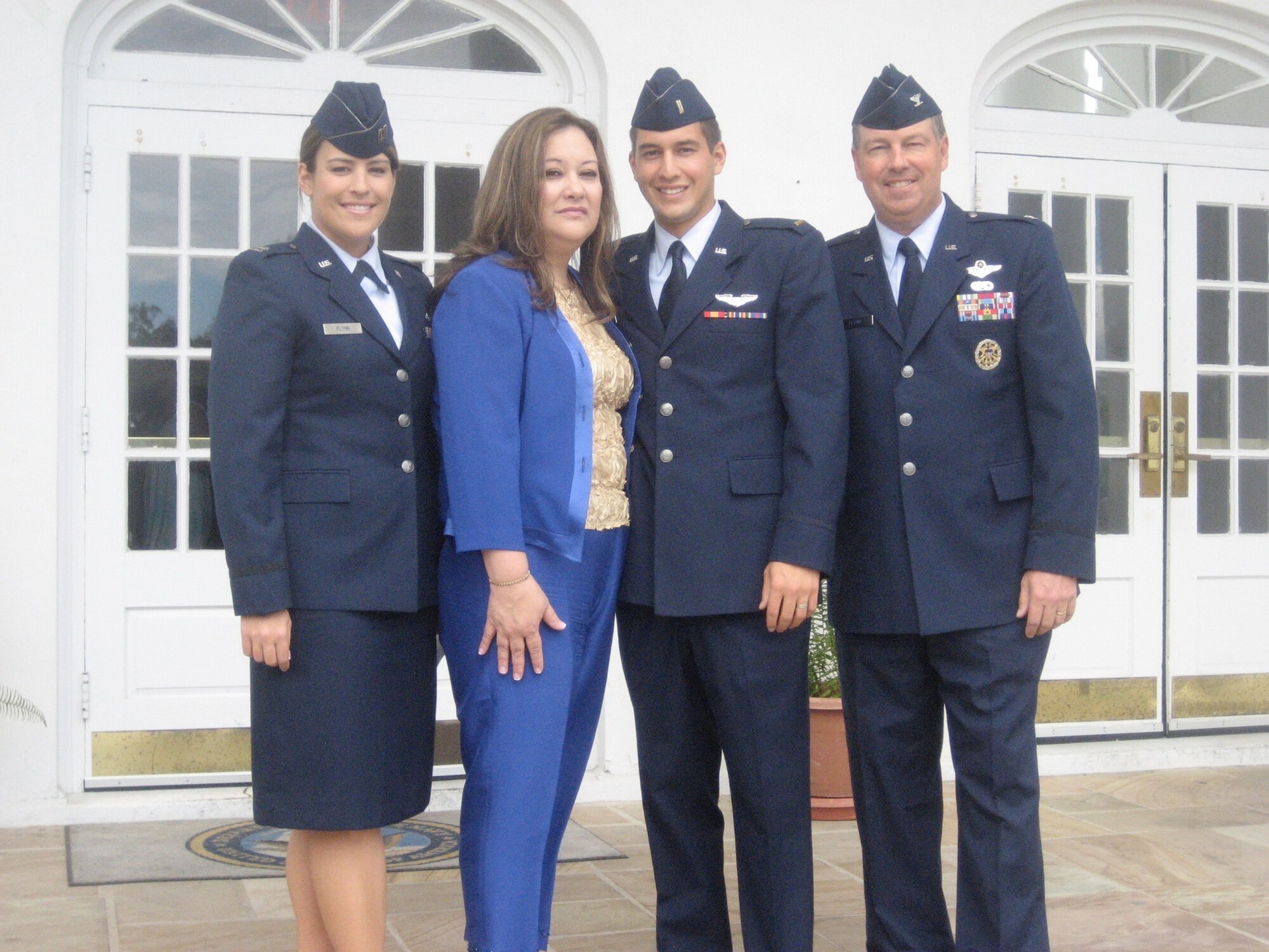 Donna Flynn poses with her family. From left: daughter, Capt. Christina Flynn; son, Capt. Brian Flynn; and husband, retired Col. Collin Flynn. (Courtesy photo) 