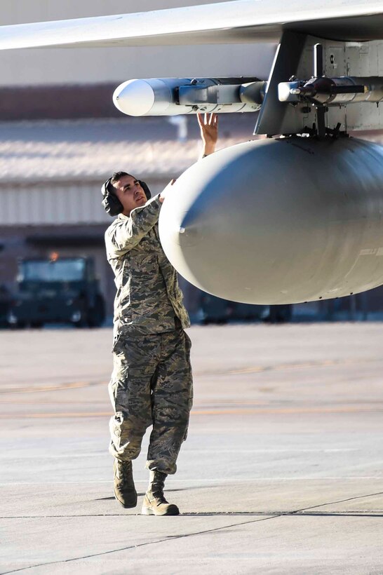 Staff Sgt. Julius Mejia, 144th Maintenance Squadron weapons loader, conducts a routine end of runway inspection on an F-15C Eagle assigned to the 144th Fighter Wing, Fresno Air National Guard Base, Calif. as part of Red Flag 16-1 held at Nellis Air Force Base, Nev. Feb. 9, 2016. The weapons load crew work in teams of three and are responsible to inspect, maintain and make repairs on aircraft release, launches, and suspension and monitor systems of munitions. (U.S. Air National Guard photo by Senior Airman Klynne Pearl Serrano)