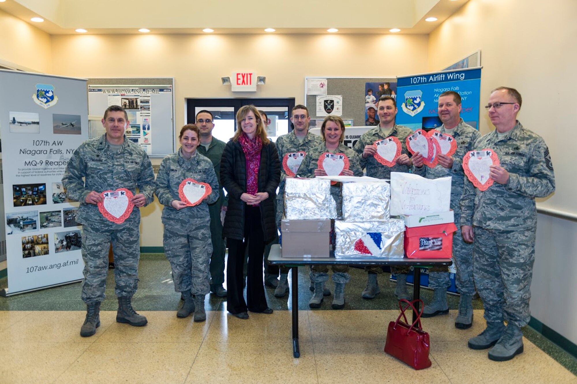 Airmen from the 107th Airlift Wing, Niagara Falls Air Reserve Station, N.Y., receive Valentine’s Day cards here from Lynne Dixon, an Erie County legislator, Feb. 10, 2016. Dixon presented the cards on behalf of children from more than 35 Erie County schools, as part of a program that is in its seventh year. (U.S. Air National Guard photo by Staff Sgt. Ryan Campbell/Released)