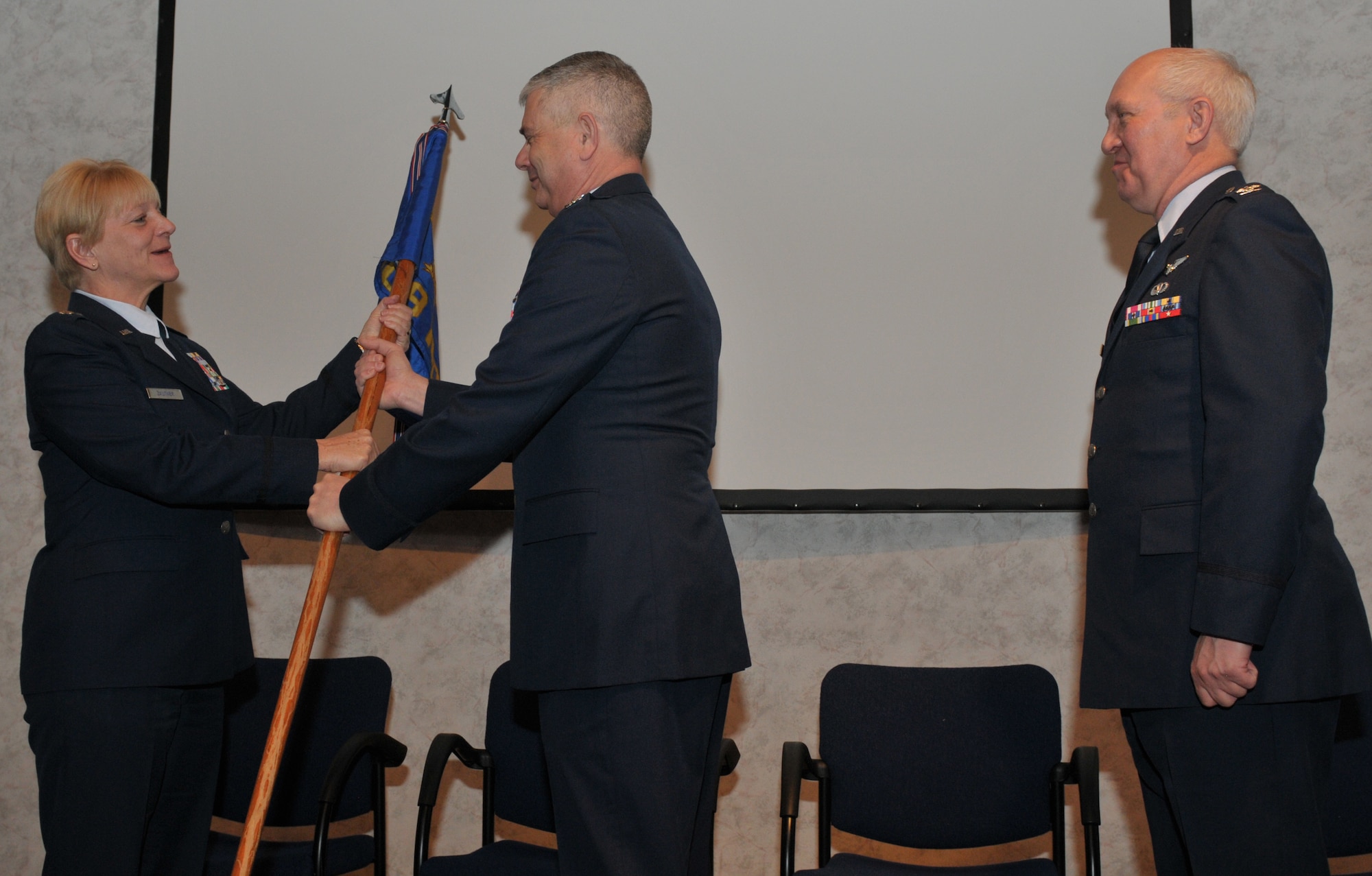 Lt. Col. Janice Zautner assumes command of the 109th Medical Group from Col. Shawn Clouthier, 109th Airlift Wing commander, during a ceremony here Feb. 7, 2016. Col. Douglas Cromack, outgoing commander, was the 109th MDG commander November 2014 through January 2016. (U.S. Air National Guard photo by Master Sgt. William Gizara/released)