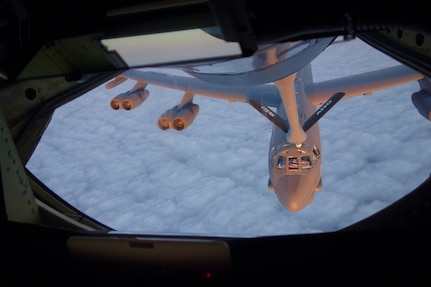 Air Force Global Strike Command (AFGSC) B-52 Stratofortress pilots display the American flag in the cockpit window as the strategic bomber receives fuel from a KC-135 Stratotanker, assigned to the 155th Air Refueling Wing, on Feb. 10, 2016. The KC-135 conducted the aerial refueling operation while transporting U.S. Air Force Lt. Gen. Stephen W. Wilson, U.S. Strategic Command (USSTRATCOM) deputy commander, and other USSTRATCOM leaders from Offutt Air Force Base, Neb., to Scott Air Force Base, Ill., where they attended USSTRATCOMâ€™s Bomber and Tanker Stakeholders Conferences. During the two-day event, U.S. Navy Adm. Cecil D. Haney, USSTRATCOM commander; U.S. Air Force Gen. Robin Rand, AFGSC commander; U.S. Air Force Gen. Carlton D. Everhart, Air Mobility Command commander; Wilson and other general officers held discussions with AFGSC wing commanders and deputy commanders as part of their continuing collaborative effort to together develop the next generation of leaders. These recurring forums are designed to assess the health and direction of the nation's strategic forces, including ICBM, ballistic missile submarine, bomber and supporting tanker forces, as well as sensors and communication networks. One of nine DoD unified combatant commands, USSTRATCOM has global strategic missions, assigned through the Unified Command Plan, which include strategic deterrence; space operations; cyberspace operations; joint electronic warfare; global strike; missile defense; intelligence, surveillance and reconnaissance; combating weapons of mass destruction; and analysis and targeting. (USSTRATCOM photo by U.S. Navy Capt. Pamela S. Kunze)