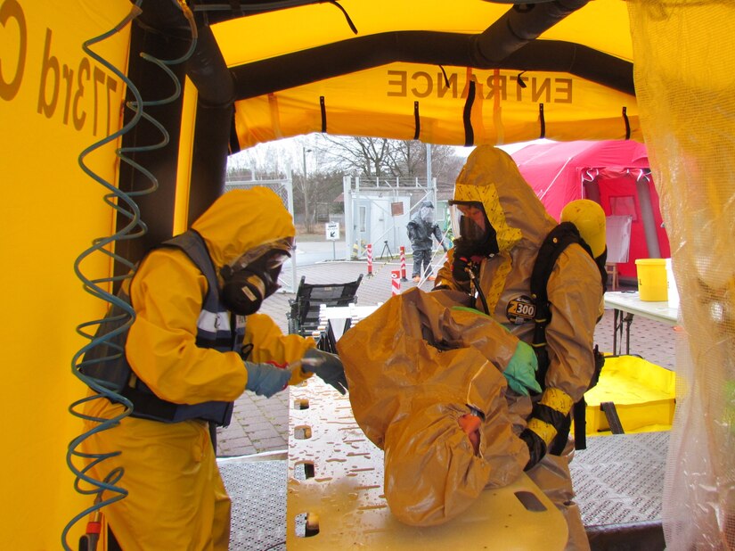 Members of the 773rd Civil Support Team wash and decontaminate the victim of a simulated chemical spill during exercise Ocean Response Wednesday, Feb. 11, 2016 at Rhine Ordnance Barracks in Germany. The 773rd trained along with members of the Spanish Unidad Militar de Emergencias and the Slovenian army during the exercise. (Photo by Lt. Col. Jefferson Wolfe, 7th Mission Support Command public affairs office)