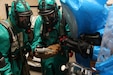 Members of the 773rd Civil Support Team and the Spanish Unidad Militar de Emergencias compare readings on their instruments at a table simulating production of methamphetamine during the exercise Ocean Response Feb. 11, 2016 at Rhine Ordnance Barracks in Germany. The 773rd and the UME trained along with members of the Slovenian army during the exercise. (Photo by Lt. Col. Jefferson Wolfe, 7th Mission Support Command public affairs office)