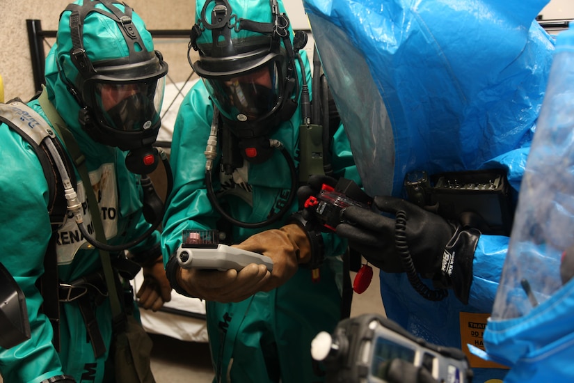 Members of the 773rd Civil Support Team and the Spanish Unidad Militar de Emergencias compare readings on their instruments at a table simulating production of methamphetamine during the exercise Ocean Response Feb. 11, 2016 at Rhine Ordnance Barracks in Germany. The 773rd and the UME trained along with members of the Slovenian army during the exercise. (Photo by Lt. Col. Jefferson Wolfe, 7th Mission Support Command public affairs office)