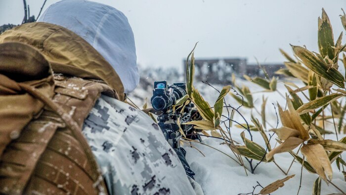 A U.S. Marine provides security and overwatch for Marines conducting urban operations during Forest Light 16-2 in Yausubetsu Training Area, Hokkaido, Japan, Jan. 28, 2016. The Japan and U.S. forces demonstrated each other’s tactics for securing the area around an enemy urban zone and breaching the urban area. The exercise strengthens military partnership, solidifies regional security agreements and improves individual and unit-level skills. The JGSDF soldiers are with the 27th Infantry Regiment, 5th Brigade, Northern Army. The Marines are with Kilo Company, 3rd Battalion, 5th Marine Regiment currently assigned to 4th Marine Regiment, 3rd Marine Division, III Marine Expeditionary Force. 