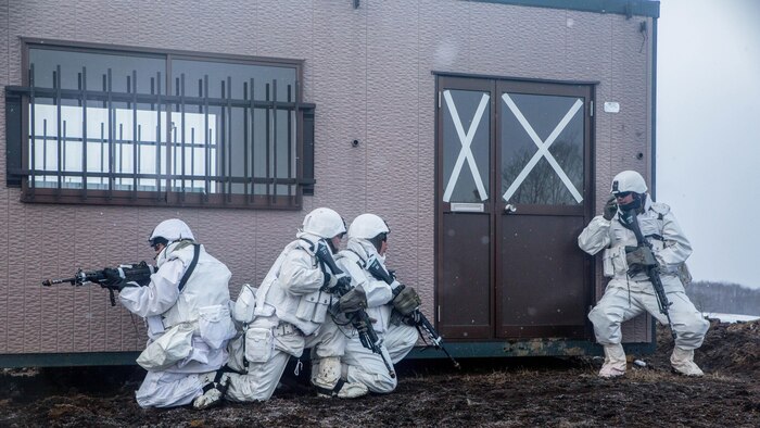 Japan Ground Self-Defense Force soldiers conduct urban operations while preparing to breach a house during Forest Light 16-2 in Yausubetsu Training Area, Hokkaido, Japan, Jan. 28, 2016. The exercise strengthens military partnership, solidifies regional security agreements and improves individual and unit-level skills. The JGSDF soldiers are with the 27th Infantry Regiment, 5th Brigade, Northern Army. The Marines are with Kilo Company, 3rd Battalion, 5th Marine Regiment currently assigned to 4th Marine Regiment, 3rd Marine Division, III Marine Expeditionary Force through the unit deployment program.