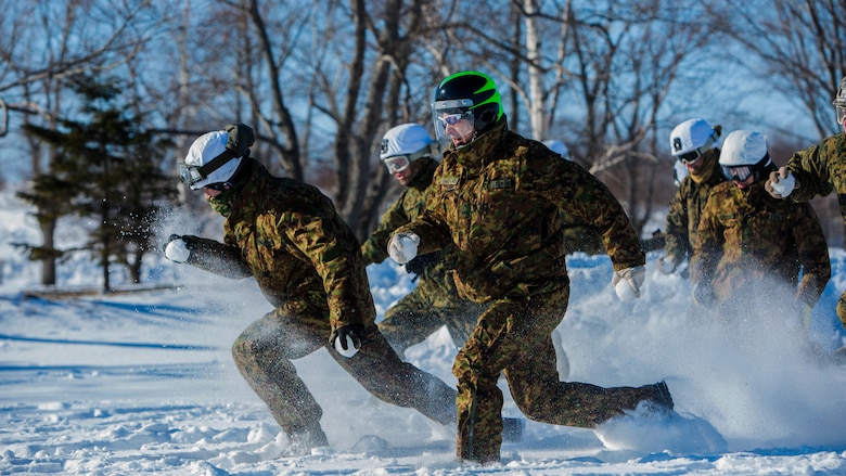 U.S. Marines and Japan Ground Self-Defense Force Soldiers sprint forward to capture the flag during a snowball fight championship for Forest Light 16-2 in Yausubetsu Training Area, Hokkaido, Japan, Jan. 31, 2016. Forest Light, a semi-annual exercise between the JGSDF and III Marine Expeditionary Force, strengthens military partnership, solidifies regional security agreements and improves individual and unit-level skills. The JGSDF soldiers are with the 27th Infantry Regiment, 5th Brigade, Northern Army. The Marines are with 3rd Battalion, 5th Marine Regiment currently assigned to 4th Marine Regiment, 3rd Marine Division, III MEF through the unit deployment program.
