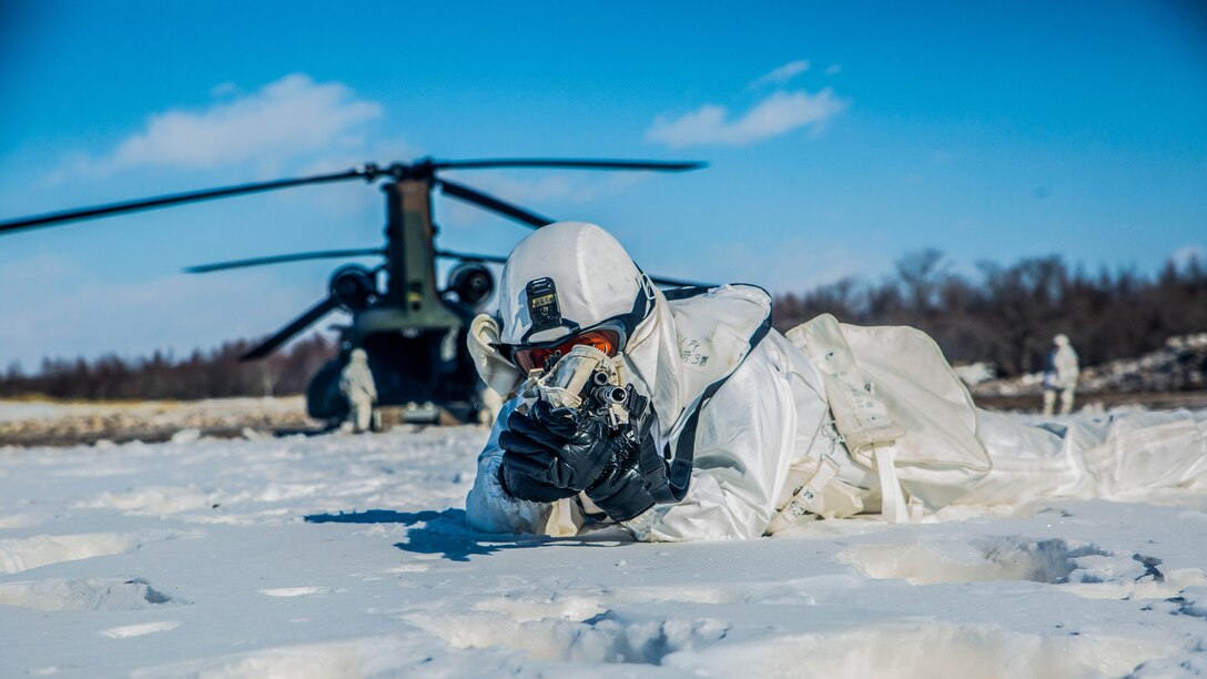 A Japan Ground Self Defense Force member provides security for a CH-47 Chinook during Forest Light 16-2 in Yausubetsu Training Area, Hokkaido, Japan, Feb. 1, 2016. The exercise strengthens military partnership, solidifies regional security agreements and improves individual and unit-level skills. The JGSDF soldiers are with the 27th Infantry Regiment, 5th Brigade, Northern Army. The Marines are with Kilo Company, 3rd Battalion, 5th Marine Regiment currently assigned to 4th Marine Regiment, 3rd Marine Division, III Marine Expeditionary Force. 