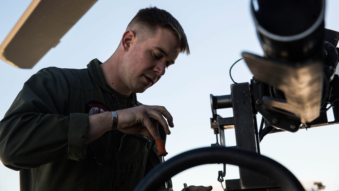 Sgt. Benjamin Hebert, a crew chief with Marine Light Attack Helicopter Squadron 469 based out of Marine Corps Air Station Camp Pendleton, Calif., performs maintenance on a UH-1Y “Venom” helicopter aboard Marine Corps Air Station Yuma, Ariz., Friday, Feb. 5, 2016.