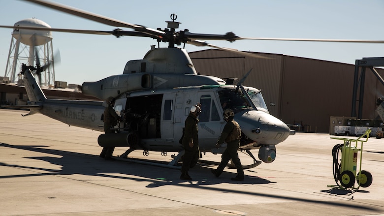 Marines with Marine Light Attack Helicopter Squadron 469, based out of Marine Corps Air Station Camp Pendleton, Calif., perform pre-flight inspections on a UH-1Y “Venom” aboard Marine Corps Air Station Yuma, Ariz., Friday, Feb. 5, 2016.