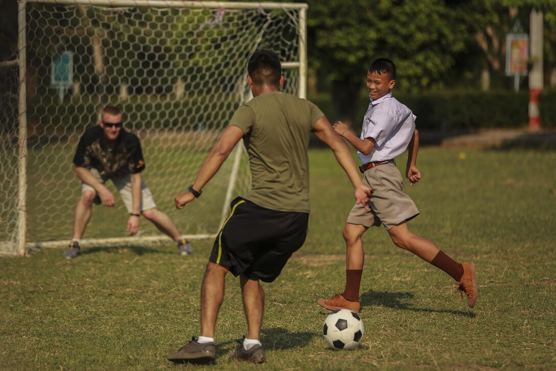 U.S. Marines with Combat Logistics Battalion 3 (CLB3), play soccer with the students at Ban Phromnimit School, in Wang Yeng Nam, during exercise Cobra Gold, Feb. 5, 2016. Cobra Gold 2016, in its 35th iteration, includes a specific focus on humanitarian civic action, community engagement, and medical activities conducted during the exercise to support the needs and humanitarian interests of civilian populations around the region.