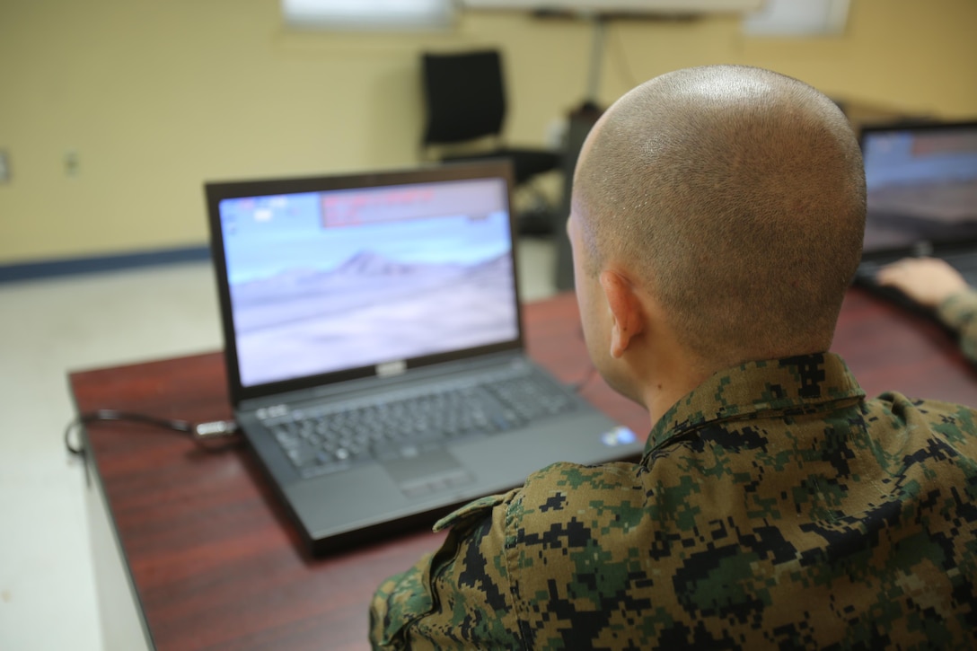 An instructor with the Division Combat Skills Center works with a deployed virtual training environment at Camp Lejeune, N.C., Jan. 27, 2016. This specific program focuses on the DCSC’s goal of individual and small-unit training by providing the combat-oriented course and forcing the Marines to use the knowledge they acquired in a simulated scenario. (U. S. Marine Corps photo by LCpl. Miranda Faughn/Released)