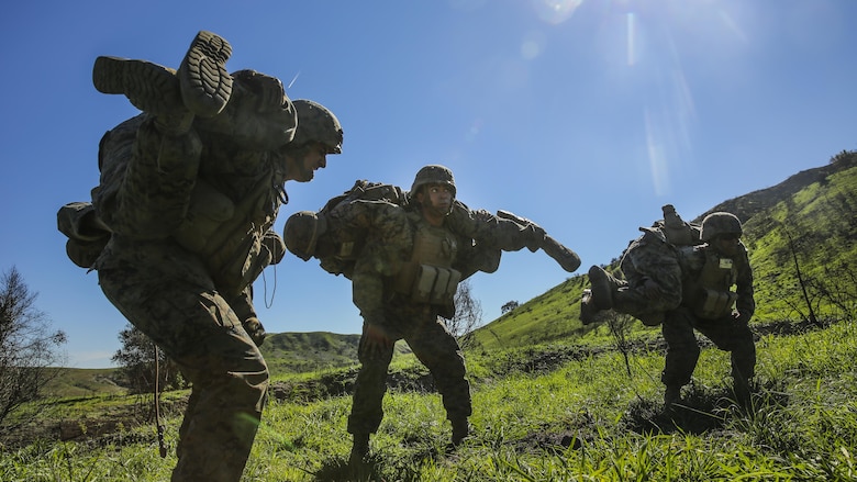 Marines perform buddy carries and other types of physical training during a combat endurance challenge at Marine Corps Base Camp Pendleton, Calif. Feb. 5, 2016. The challenge consisted of hiking nearly seven miles, testing weapons systems, combat lifesaving skills, land navigation and simulated casualty evacuation. The Marines with Battery Q, 5th Battalion, 11th Marine Regiment conducted the training aboard MCB Camp Pendleton. 