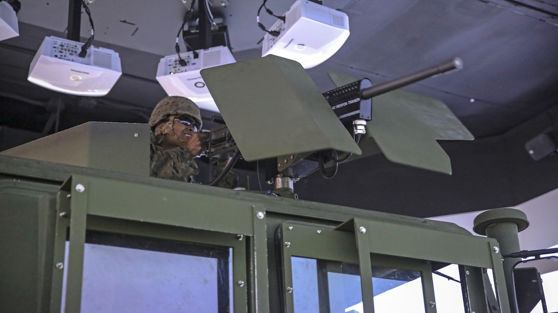 Lance Cpl. Samuel T. Mahaffey, a motor vehicle operator with 8th Engineer Support Battalion, fires a practice M2 .50-caliber machine gun during a convoy operations training simulation at Marine Corps Base Camp Lejeune, N.C., Feb. 9, 2016. Throughout the simulation, vehicle gunners practiced using the M2 .50-caliber machine gun and Mk-19 automatic grenade launcher. 