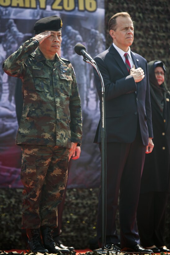 Royal Thai Army Supreme Commander, Gen. Sommai Kaotira and U.S. Ambassador Glyn Davies (right), salute to the U.S. and Thailand national anthems during the opening ceremony for Exercise Cobra Gold at the Royal Thai Marine Corps Headquarters in Sattahip, Thailand, Feb. 9, 2016. Cobra Gold will consist of three primary events: a command post exercise, which includes a senior leader seminar; humanitarian civic assistance projects in Thai communities; and a field training exercise that will build regional relationships.
