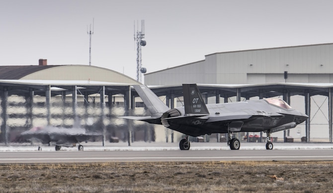 Two F-35A Lightning IIs taxi after landing at Mountain Home Air Force Base, Idaho, Feb. 8, 2016. The F-35s, from Edwards AFB, Calif., will be part of an initial operating capability test at the nearby range complex. (U.S. Air Force photo/Tech. Sgt. Samuel Morse)