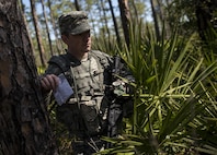 Sgt. 1st Class Seth Eaton, U.S. Army Reserve military police Soldier with the 300th MP Brigade, of Stow, Ohio, takes on a land navigation course in this year's 200th Military Police Command's Best Warrior Competition held at Camp Blanding, Fla., Feb. 9. The winning noncommissioned officer and junior enlisted Soldiers will move on to the U.S. Army Reserve Command competition in May. (U.S. Army photo by Master Sgt. Michel Sauret)