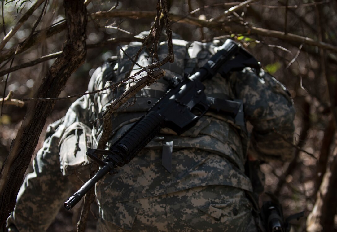 Sgt. 1st Class Seth Eaton, U.S. Army Reserve military police Soldier with the 300th MP Brigade, of Stow, Ohio, takes on a land navigation course in this year's 200th Military Police Command's Best Warrior Competition held at Camp Blanding, Fla., Feb. 9. The winning noncommissioned officer and junior enlisted Soldiers will move on to the U.S. Army Reserve Command competition in May. (U.S. Army photo by Master Sgt. Michel Sauret)