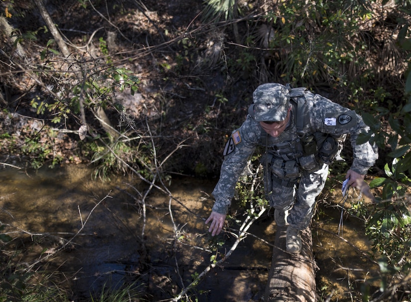 Sgt. 1st Class Seth Eaton, U.S. Army Reserve military police Soldier with the 300th MP Brigade, of Stow, Ohio, takes on a land navigation course in this year's 200th Military Police Command's Best Warrior Competition held at Camp Blanding, Fla., Feb. 9. The winning noncommissioned officer and junior enlisted Soldiers will move on to the U.S. Army Reserve Command competition in May. (U.S. Army photo by Master Sgt. Michel Sauret)